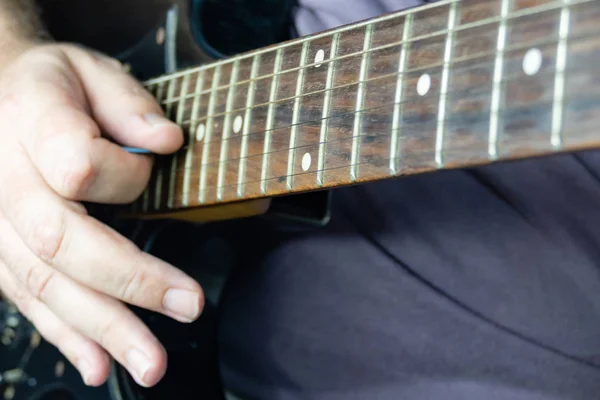 Close-up of man playing lead guitar solo — Stock Photo, Image