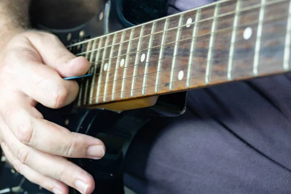 Close-up of man playing lead guitar solo — Stock Photo, Image