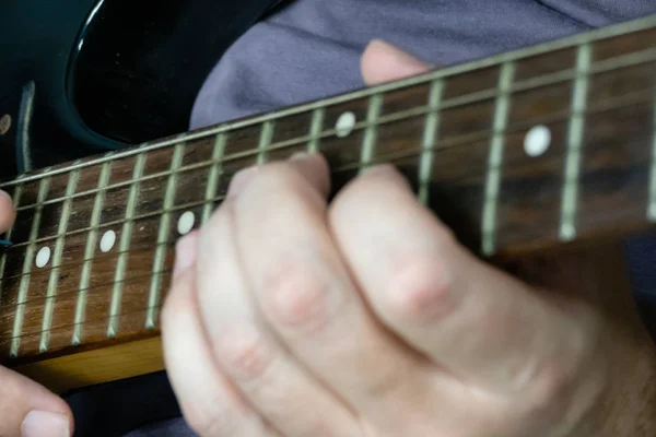 Close-up of man playing lead guitar solo — Stock Photo, Image