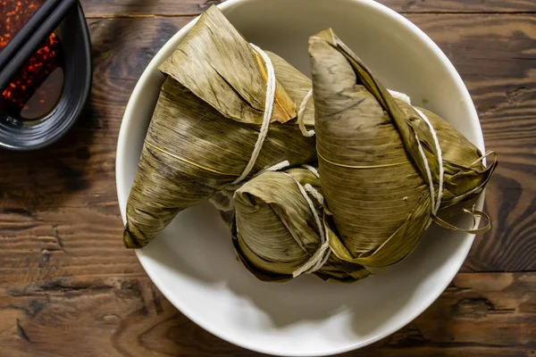 Zongzi, a traditional food for dragon boat festival and chili — Stock Photo, Image