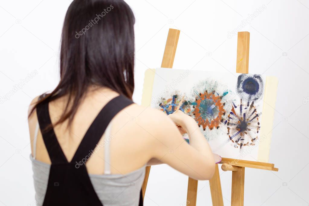 Artist painting on an easel