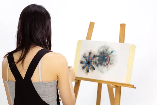Artist painting on an easel — Stock Photo, Image