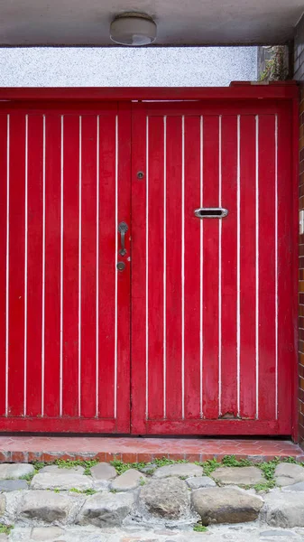 Red wooden panel double doors with mail slot — Stock Photo, Image