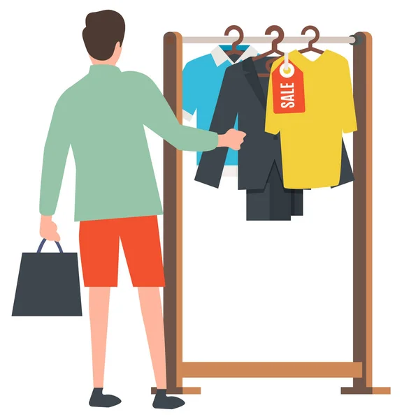 Homem escolhendo roupas elegantes no centro de transporte — Vetor de Stock