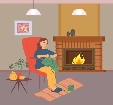 Kadın Needlecraft, şömine taşıyıcısının yanında örgü örüyor.