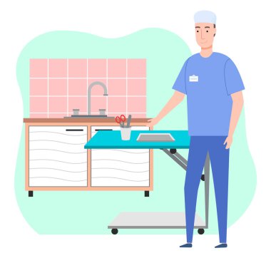 Veteriner veteriner veteriner veteriner veteriner kliniğinde, sağlık kıyafeti giyen adam hayvanlar için masanın yanında duruyor.