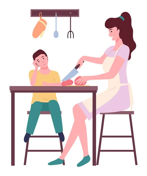 Joven madre cocinando con su hijo, cortando tomate en la cocina, gente sentada cerca de la mesa de la cocina — Vector de stock