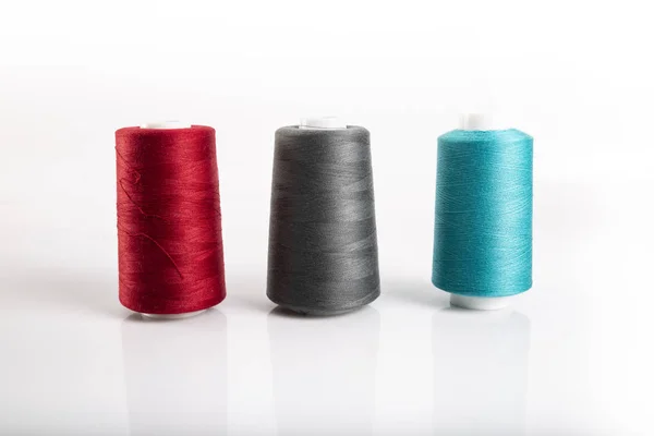 Bobbins of colorful cotton threads. Sewing accessories