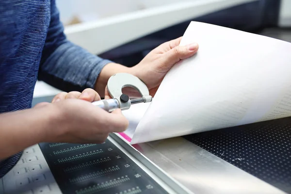 The printer measures the weight of the paper.