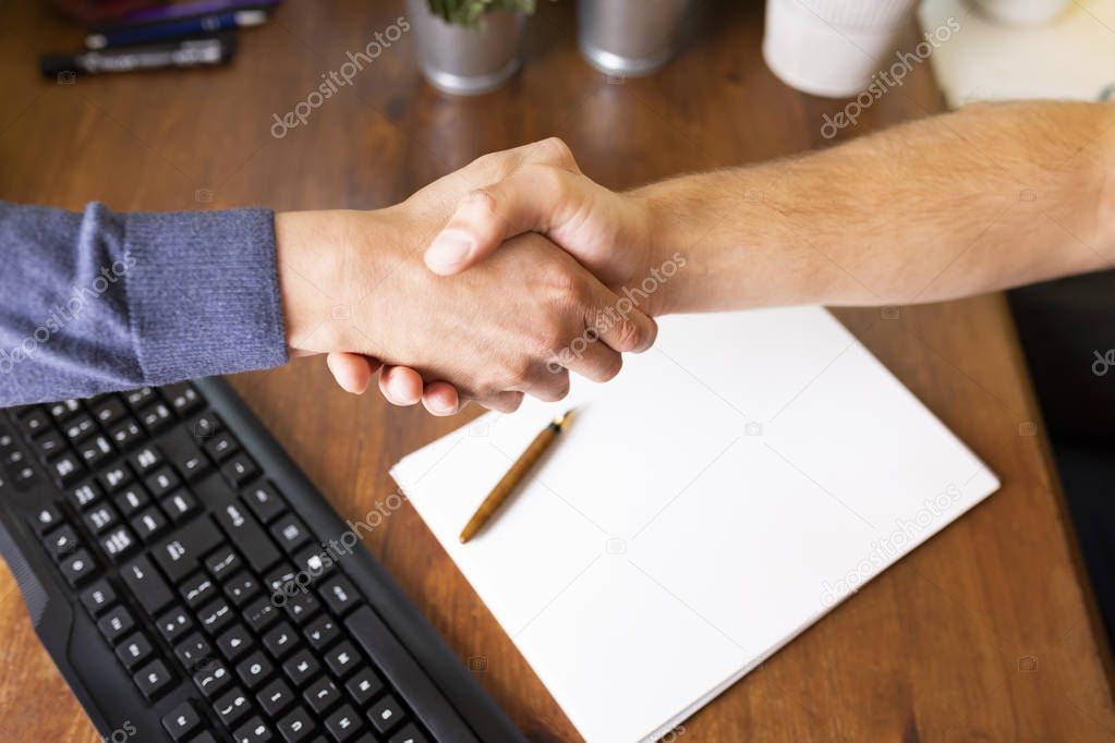 Handshake. Mens hands in an embrace. Business and success.