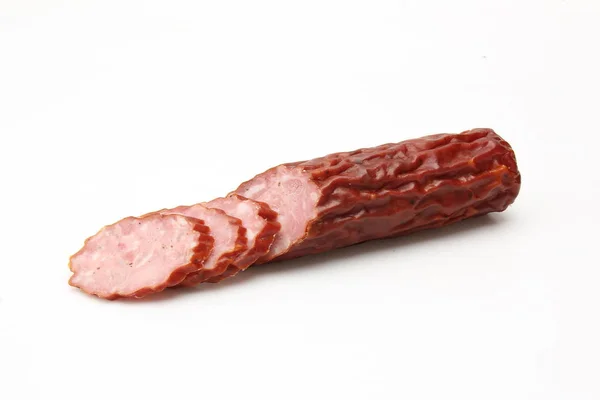 Dry sausage. Traditional sausage on a white background. — Stock Photo, Image