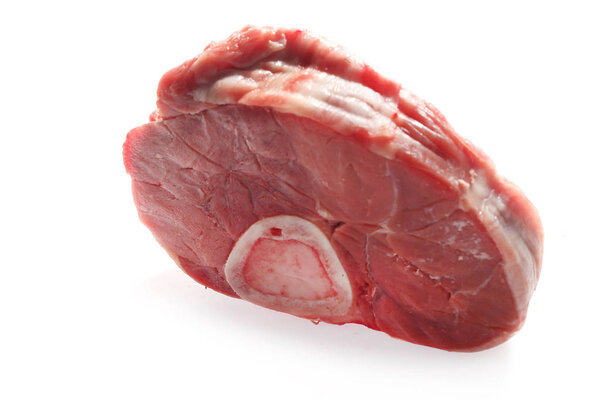 Beef shank with bone. Raw meat on a white background.