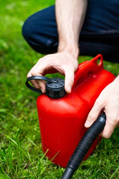 Vertical View Male Hand Opening Red Plastic Fuel Canister Funnel — Stock Photo, Image