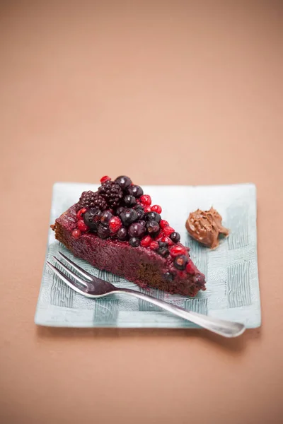 Stock image Tasty chocolate cake on plate and fork