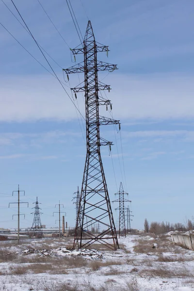 High voltage power tower in winter day