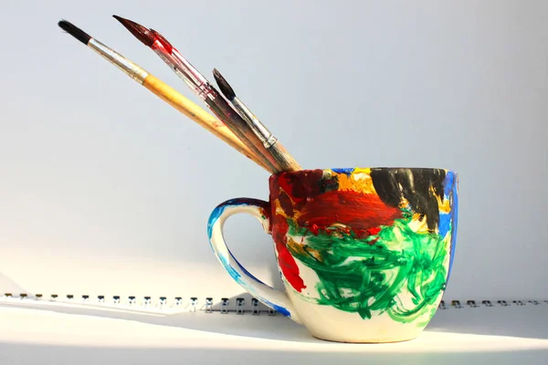 Art paint brushes in a cup with empty space for text — Stock Photo, Image