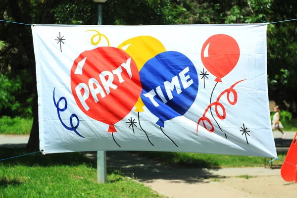 Festive Party Time banner with copy space, summer street background.