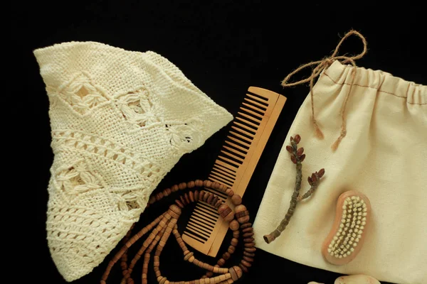 Zero waste women\'s accessories, natural brush, wooden hair comb and beads, straw hat, reusable cotton hand made bag.