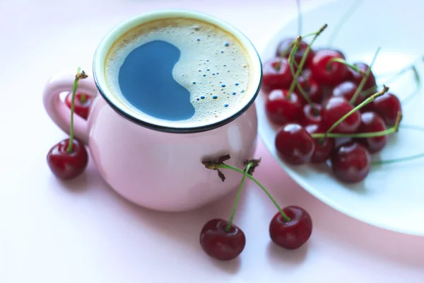 Coffee and cherries, minimalistic food concept. Top view, copy space.