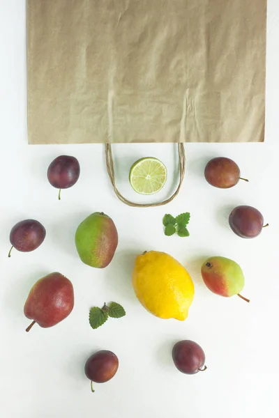Healthy food in a kraft paper bag. Zero waste concept, colorful reusable eco bags.