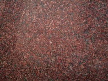 Mutfak atölyesi, masa, pencere pervazı, çit için kullanılan kırmızı granit arka plan. Koyu pembe yanıcı mermer taş dokusu. Metin tabelası reklam tasarımı modeli. Mimari detay doğal arkaplan.