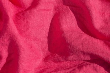 Pembe keten kumaş dokusu üst görünümü. Kırmızı mercan arka planı. Moda rengi kadın kıyafetleri moda. Kadın blog arkaplanı metin işaretleri arzulanıyor. Kız soyut duvar kağıdı, tekstil yüzeyi. Doğal ekolojik malzeme.