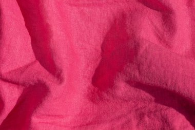 Pembe keten kumaş dokusu üst görünümü. Kırmızı mercan arka planı. Moda rengi kadın kıyafetleri moda. Kadın blog arkaplanı metin işaretleri arzulanıyor. Kız soyut duvar kağıdı, tekstil yüzeyi. Doğal ekolojik malzeme.