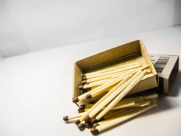matches pile lie about a box on a white background