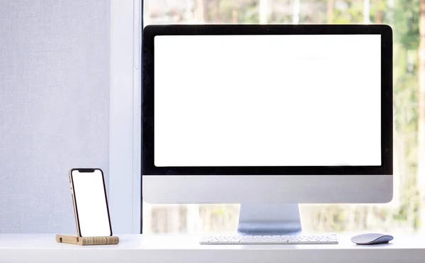 Mock up of a phone and a computer in a minimalism modern room, flat