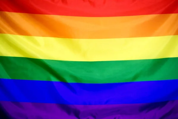 Ουράνιο τόξο πολύχρωμο ΛΟΑΤ σημαία ως φόντο — Φωτογραφία Αρχείου