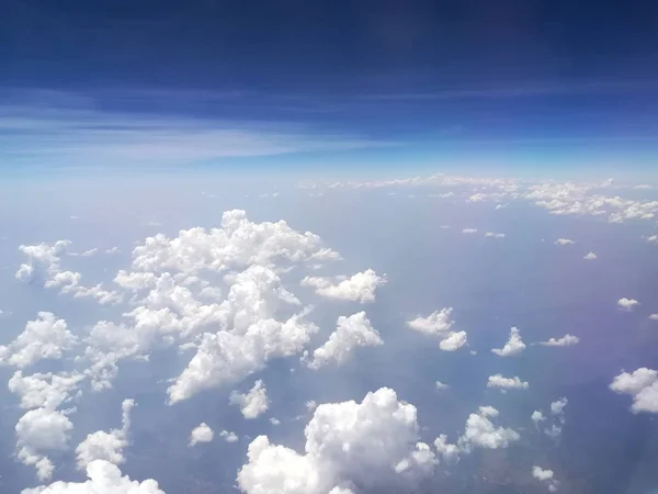 Photos of clouds from a height. Cloudy sky. Beautiful clouds in the blue sky. Clouds in clear weather. Sky texture The texture of the clouds. The texture of the earth.