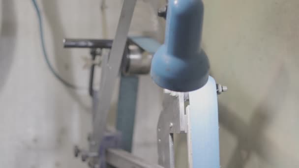 Belt grinder being operated by a worker — Stock Video