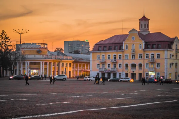 Summer or early autumn square of ukrainian town at sunset