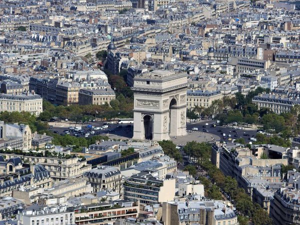 Day view of the arc de Triomphe and Paris from the height of the Eiffel tower