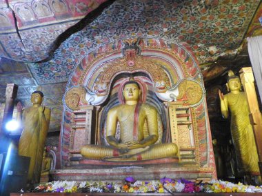 The golden temple of Dambulla is world heritage site and has a total of a total of 153 Buddha statues, three statues of Sri Lankan kings and four statues of gods and goddesses. clipart