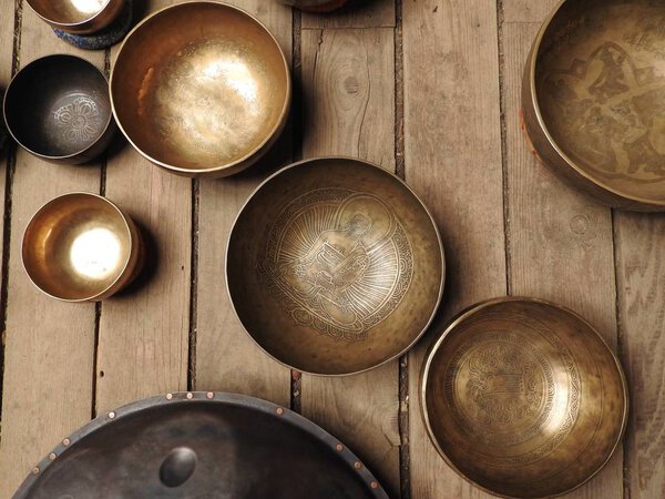 Singing bowls-Cup of life - popular mass product souvenir in Nepal, Tibet and India-stay on ethnic traditional wooden ornament