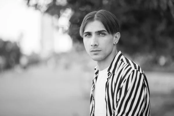 Portrait of a gay man - member of the LGBTQ community. Black and white photo. BW