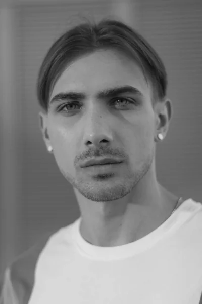 Portrait of a gay man - member of the LGBTQ community. Black and white photo. BW