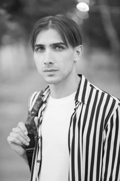 Portrait of a gay man - member of the LGBTQ community. Black and white photo. BW