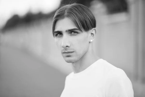 Portrait of a gay man - member of the LGBTQ community. Black and white photo. BW