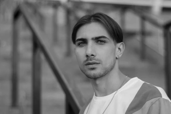 Portrait of a gay man - member of the LGBTQ community. Black and white photo. BW