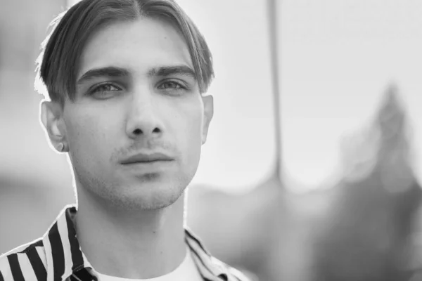 Portrait of a gay man - member of the LGBTQ community. Black and white photo. BW