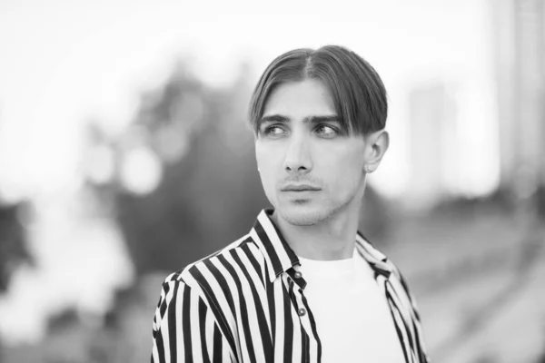 Portrait of a gay man - member of the LGBTQ community. Black and white photo. BW