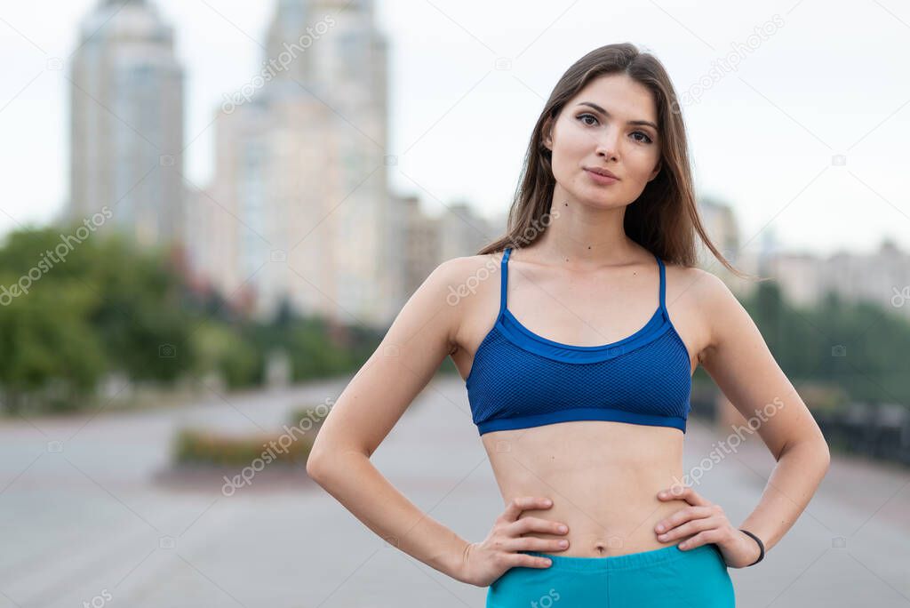 Portrait of a beautiful young sporty brunette girl