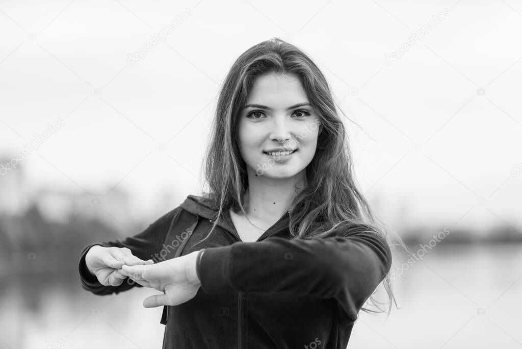Sports and healthy lifestyle : Brunette girl doing sports exercises. Black and white photo. BW