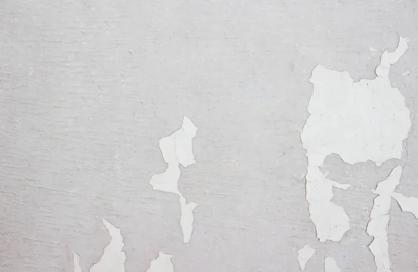 Graue Betonwand Mit Weißer Abblätternder Farbe Weiße Farbe Die Wand lizenzfreie Stockfotos