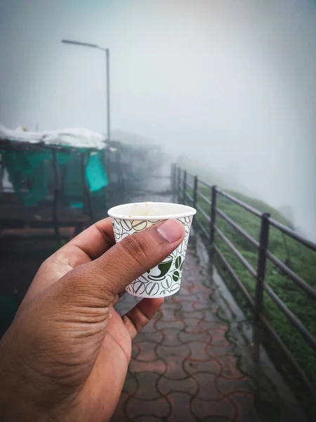 Tea cup in hands point of view — Stock Photo, Image