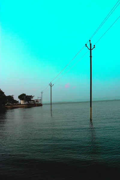 lighting pillars are standing inside water reservoir in thuti dam, Vyara, Gujarat, India