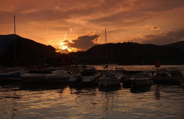 The sun sets over the mountain. Sunset on Lake Como in the city of Como.