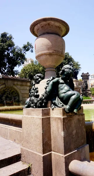 Dark cupid statue in the park